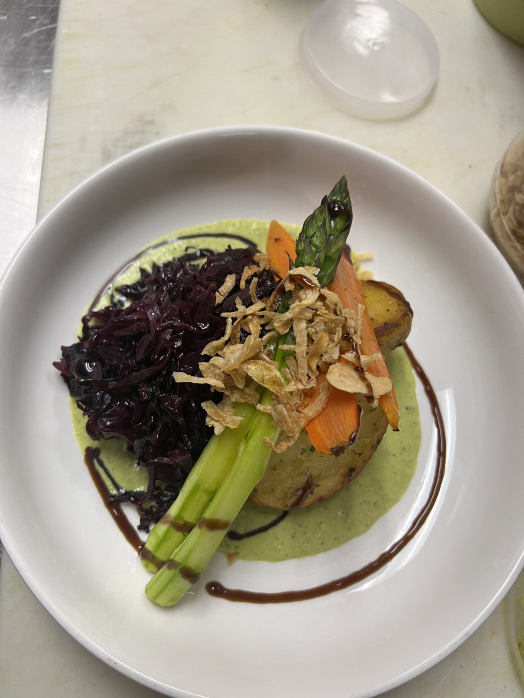 Fine-plated vegan dish with seasonal vegetables